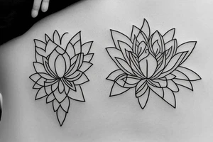A single line delicate tattoo with a lotus with elements of fine lines and dots & circles behind it tattoo idea