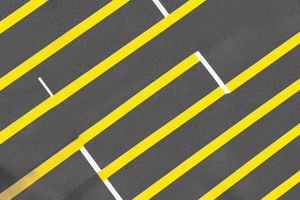 Black asphalt road with yellow parallel stripes shot from above tattoo idea