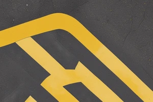 Black asphalt road with parallel yellow stripes shot from above tattoo idea