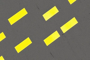 Black asphalt road with parallel yellow stripes shot from above tattoo idea