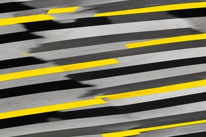 Black asphalt road with parallel yellow stripes shot from above tattoo idea