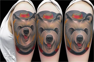 angry bear walking with Francis of Assisi tattoo idea