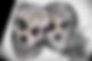 A face, the left side of the face is the face of a male Angel. The right side of the face is the face of a reaper. The face is Divided into two by a straight line. tattoo idea