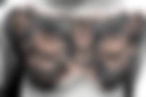 Scary owl on chest tattoo idea