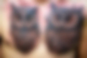 Scary owl on chest tattoo idea