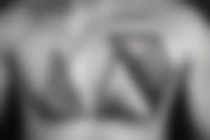 triangle on a chest tattoo idea