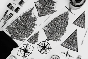 A fir tree next to a compass tattoo idea