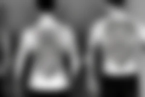 Three brothers standing, arms over each other tattoo idea