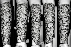 Snake in flowers tattoo idea
