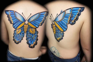 Butterfly with white and blue wings that were once broken but glued back together with gold  kintsugi tattoo idea