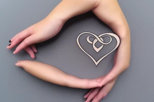An infinity shape for a mother and three daughters. Must be inscribed "Humble and Kind". On a white background tattoo idea