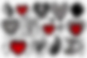 Red heart shaped gemstone with black and grey filigree surrounding it tattoo idea