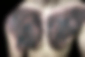 lion mane hair drawn as dragon scale armour tattoo idea