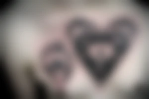 a heart with crying eyes tattoo idea