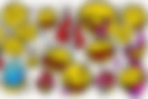 yellow smiley face melting in colorful fire tattoo idea