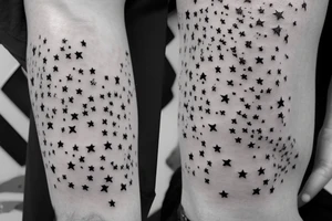 one line of script with small stars around it tattoo idea