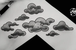 black linework clouds on a horizon tattoo idea