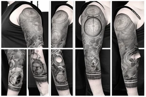full sleeve tatoo with world map background, compass and man sculpting the a stone and other related elements tattoo idea