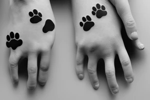 dog paw touching hand tattoo idea