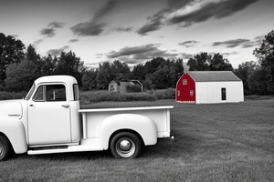 A red with white roof 1953 5-window GMC pickup parked at an angle in front of a red barn with the setting sun in the background. The setting sun is shaped like a sunflower. tattoo idea